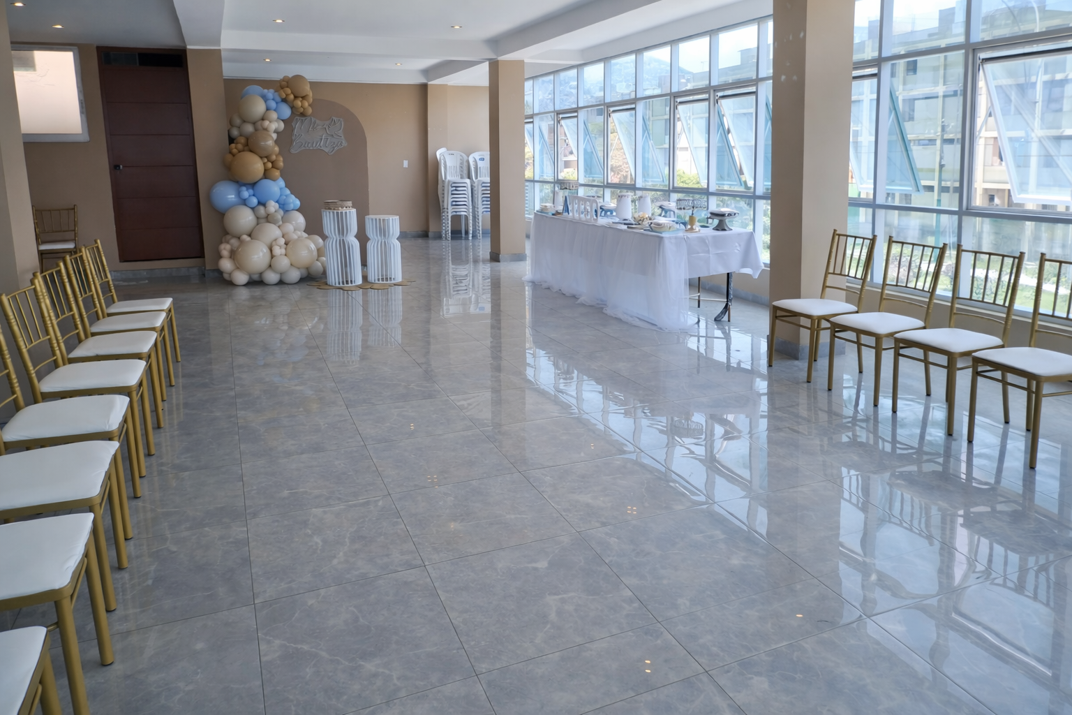 Elegant venue exterior at night with illuminated entrance and landscaping